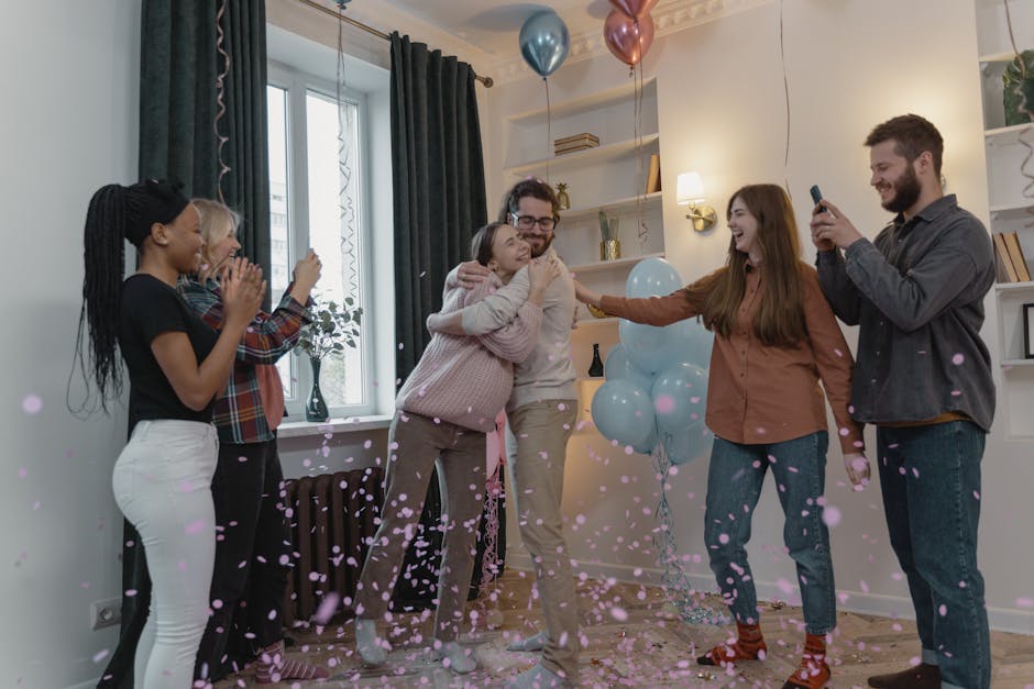 A lively indoor gathering celebrating a baby shower with friends, balloons, and confetti.